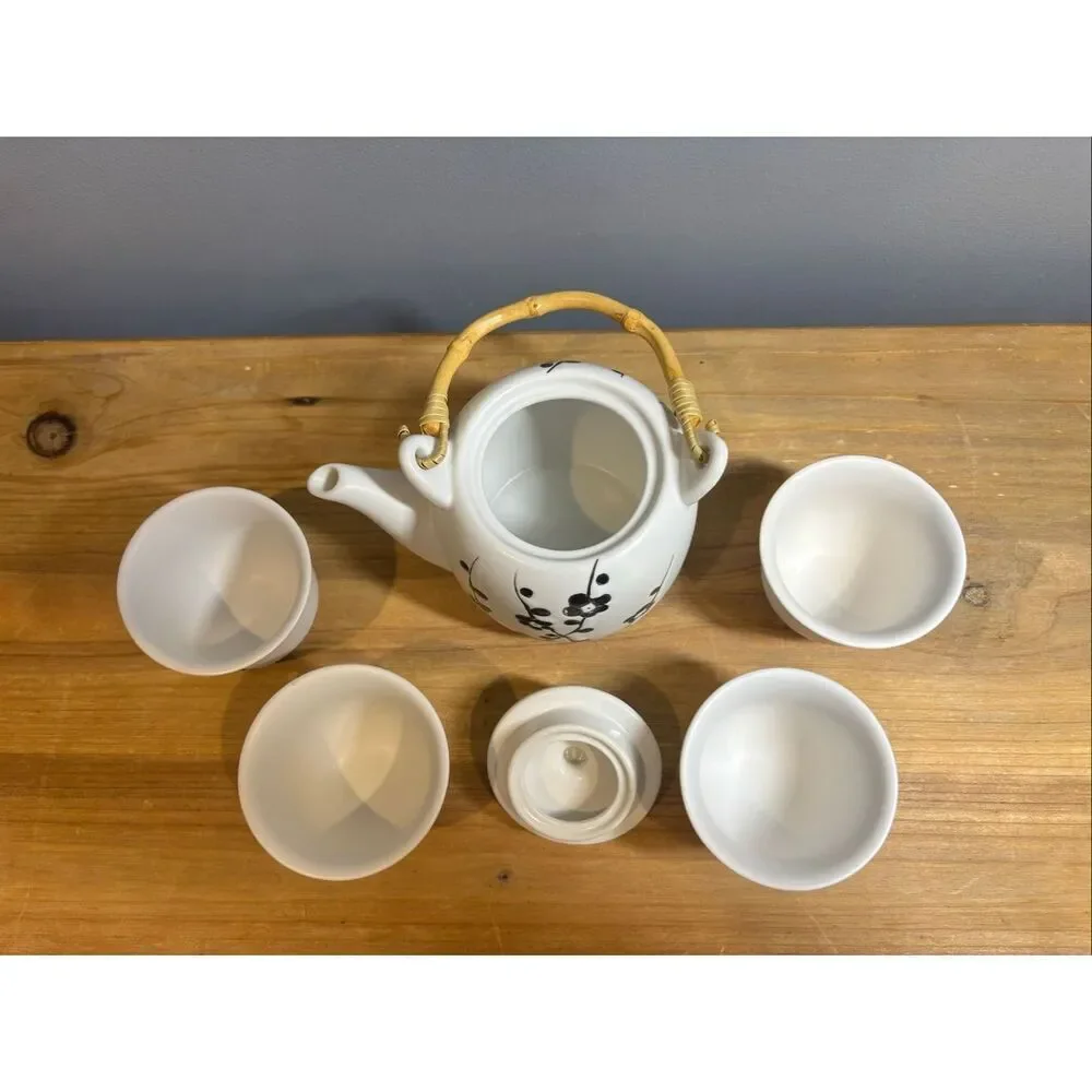White ceramic tea pot and 4 tea cups with black cherry blossoms